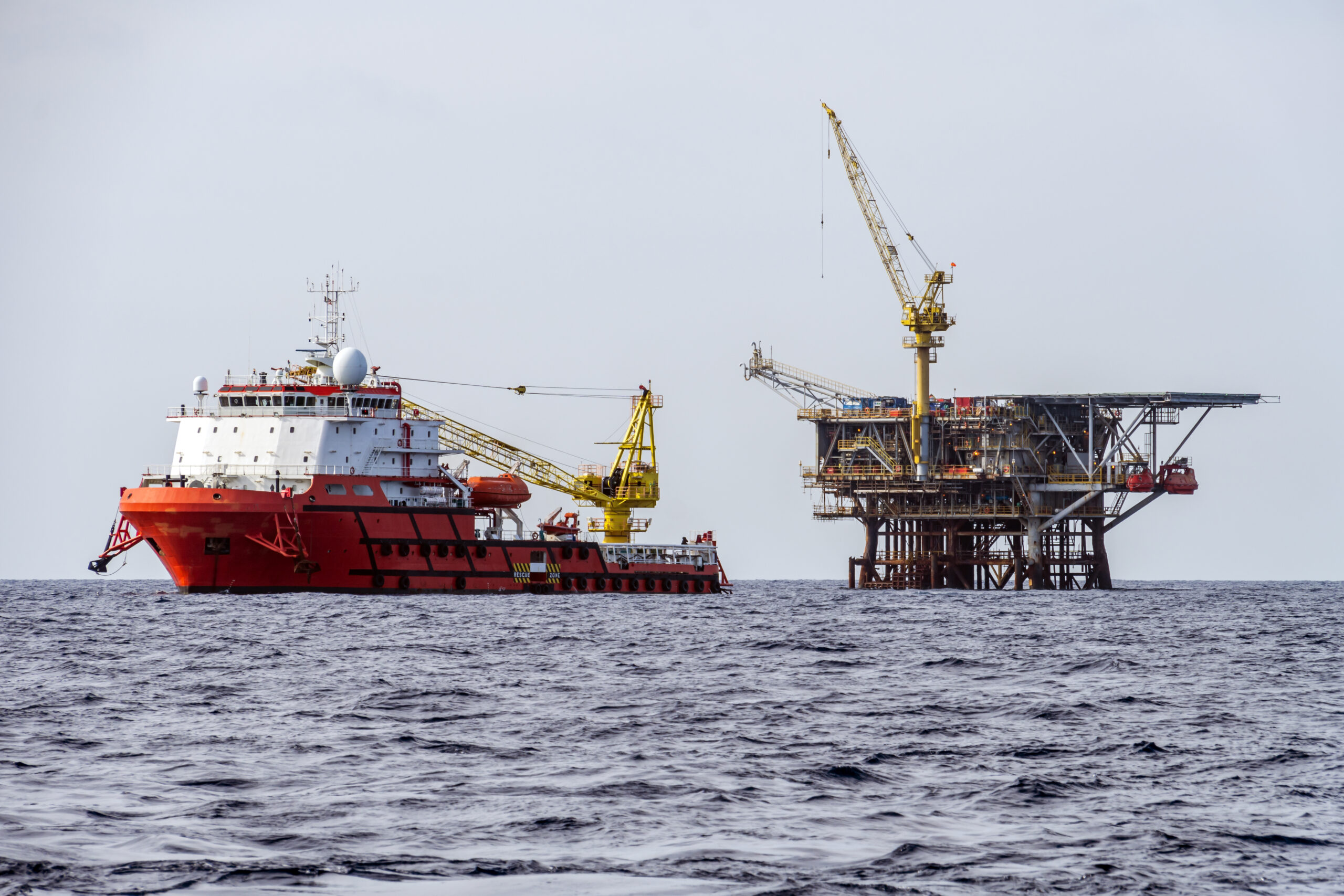 Construction Support Vessel Moored Next to a Production Satellite platform